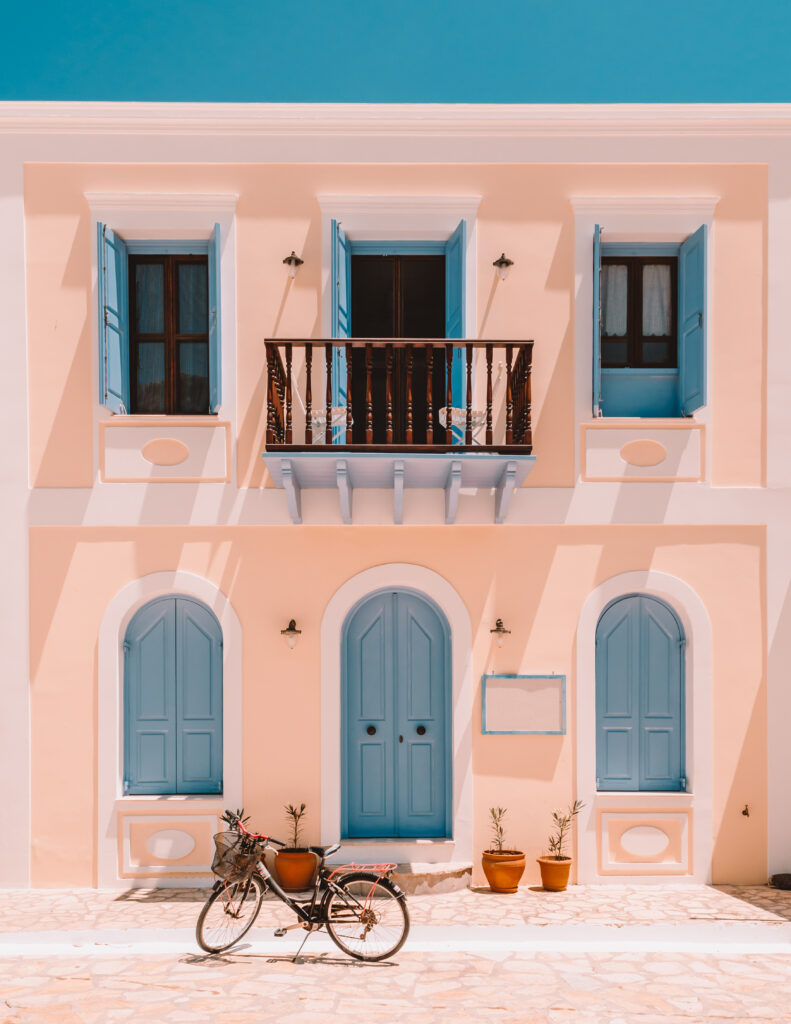 Old Greek house with blue windows and door