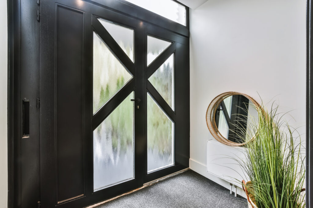 entrance with a black door
